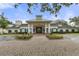 Front exterior of the community clubhouse featuring a welcoming entrance and well-maintained landscaping at 5110 Championship Cup Ln, Spring Hill, FL 34609