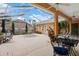 Brick paved courtyard featuring a central fountain, outdoor furniture, and covered structure at 5110 Championship Cup Ln, Spring Hill, FL 34609