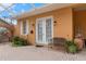 Exterior showing a quaint brick patio with a bench, surrounded by lush landscaping and windows at 5110 Championship Cup Ln, Spring Hill, FL 34609