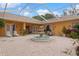 Aerial view of a brick paved courtyard with a fountain and outdoor furniture at 5110 Championship Cup Ln, Spring Hill, FL 34609