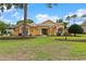 Charming home featuring a well-maintained lawn, lush landscaping, and inviting curb appeal at 5110 Championship Cup Ln, Spring Hill, FL 34609