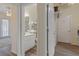 View of a hallway showing access to the bathroom and laundry room at 5110 Championship Cup Ln, Spring Hill, FL 34609