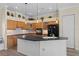 Modern kitchen with stainless steel appliances, a spacious island, and ample cabinet space at 5110 Championship Cup Ln, Spring Hill, FL 34609