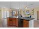 Well-designed kitchen with a center island, stainless steel dishwasher, and barstool seating at 5110 Championship Cup Ln, Spring Hill, FL 34609