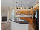 Open kitchen boasts an island, stainless steel appliances, and wood cabinets at 5110 Championship Cup Ln, Spring Hill, FL 34609