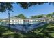Large community pool with ample seating and a nearby covered seating area at 5110 Championship Cup Ln, Spring Hill, FL 34609