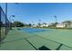 Well-maintained community tennis court with lights for nighttime play at 5110 Championship Cup Ln, Spring Hill, FL 34609