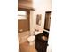 Bathroom view featuring a bathtub, shower with neutral shower curtain, vanity with a bronze sink, and decorative wall art at 5215 Hope Ln, Spring Hill, FL 34606