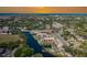 Drone shot of the Rivermist Condominiums showing a waterfront, community pool, and surrounding neighborhood at 5640 Ferguson Ct # 2106, New Port Richey, FL 34652