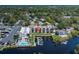 Waterfront condo building with boat dock, and neighboring house with pool on the canal at 5640 Ferguson Ct # 2106, New Port Richey, FL 34652