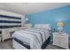 Comfortable bedroom featuring a bed with nautical decor and tasteful decor at 5640 Ferguson Ct # 2106, New Port Richey, FL 34652