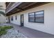 Exterior view of a condo unit in Rivermist Condominiums with a shaded entrance and well-maintained landscaping at 5640 Ferguson Ct # 2106, New Port Richey, FL 34652