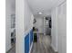 Inviting hallway with stylish decor, leading to the bedroom and kitchen, with modern gray flooring throughout at 5640 Ferguson Ct # 2106, New Port Richey, FL 34652