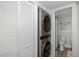 Functional laundry area with washer/dryer and easy access to the adjacent bathroom, offering convenience at 5640 Ferguson Ct # 2106, New Port Richey, FL 34652