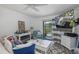 Bright living room with modern furnishings, decor, and sliding doors to a outdoor area at 5640 Ferguson Ct # 2106, New Port Richey, FL 34652