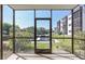 Screened patio with a view of the community dock and canal at 5640 Ferguson Ct # 2106, New Port Richey, FL 34652