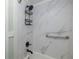 Bathroom tub and shower with marble design and modern fixtures at 5640 Ferguson Ct # 2106, New Port Richey, FL 34652