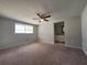 Bedroom featuring carpet and natural light from a bright window at 5651 Canosa Dr, Holiday, FL 34690