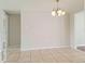 Open dining area with tiled flooring and a stylish chandelier at 5651 Canosa Dr, Holiday, FL 34690
