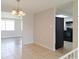 Bright dining room featuring tile flooring and a modern chandelier at 5651 Canosa Dr, Holiday, FL 34690