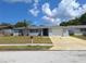 Charming single-story home with a well-maintained lawn and attached one car garage at 5651 Canosa Dr, Holiday, FL 34690