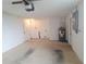 A well-lit garage features white walls, a water heater, and side door for easy access at 5651 Canosa Dr, Holiday, FL 34690