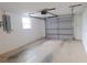 Spacious garage with plenty of room for parking and storage features clean walls at 5651 Canosa Dr, Holiday, FL 34690