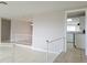 Open-concept living room flows into a kitchen with sleek countertops at 5651 Canosa Dr, Holiday, FL 34690