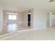 Open-concept living room with tile flooring and natural light at 5651 Canosa Dr, Holiday, FL 34690