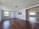 Hardwood floors and open floorplan in this spacious living room at 5651 Canosa Dr, Holiday, FL 34690