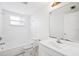 Bathroom featuring a shower and bath, vanity, toilet, and mirror at 5706 Mockingbird Dr, New Port Richey, FL 34652
