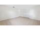 Bedroom with tile flooring, closet with sliding doors, and neutral walls at 5706 Mockingbird Dr, New Port Richey, FL 34652