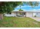 Charming single-story home with a well-maintained front yard and attached garage at 5706 Mockingbird Dr, New Port Richey, FL 34652