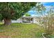 Charming single-story home with a well-maintained front yard and mature trees at 5706 Mockingbird Dr, New Port Richey, FL 34652