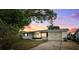 Charming single-story home featuring a well-manicured lawn and inviting curb appeal at 5706 Mockingbird Dr, New Port Richey, FL 34652