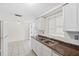 Well-lit kitchen featuring white cabinets, granite countertops, and tile backsplash at 5706 Mockingbird Dr, New Port Richey, FL 34652