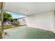 View of covered patio showing view to fenced backyard with greenery at 5706 Mockingbird Dr, New Port Richey, FL 34652