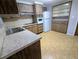Eat-in kitchen with white appliances and ample cabinet space at 5949 1St Ave, New Port Richey, FL 34652
