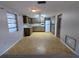 Eat-in kitchen with white appliances and ample cabinet space at 5949 1St Ave, New Port Richey, FL 34652