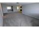 Spacious living room featuring new carpeting and neutral paint at 5949 1St Ave, New Port Richey, FL 34652