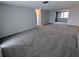 Spacious living room featuring new carpeting and neutral paint at 5949 1St Ave, New Port Richey, FL 34652