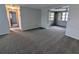 Spacious living room featuring new carpeting and neutral paint at 5949 1St Ave, New Port Richey, FL 34652