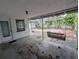 Covered patio with concrete floor and backyard views at 5949 1St Ave, New Port Richey, FL 34652