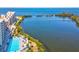 Aerial view of pool and lake showing waterfront living at 6035 Sea Ranch Dr # 209, Hudson, FL 34667