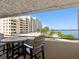 Balcony with seating overlooks the community area and waterfront, perfect for outdoor enjoyment at 6035 Sea Ranch Dr # 209, Hudson, FL 34667