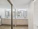 Bathroom features double sinks, marble countertops, and a large mirrored closet at 6035 Sea Ranch Dr # 209, Hudson, FL 34667