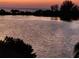 Tranquil bay view with reflections of silhouetted trees during sunset at 6035 Sea Ranch Dr # 209, Hudson, FL 34667