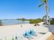 This property has a lovely beach that features colorful lounge chairs and picnic tables for enjoying the waterfront at 6035 Sea Ranch Dr # 209, Hudson, FL 34667