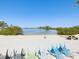 This property has a lovely beach that features colorful lounge chairs and picnic tables for enjoying the waterfront at 6035 Sea Ranch Dr # 209, Hudson, FL 34667