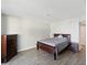 Comfortable bedroom features a queen-sized bed and ample storage with matching wood furniture at 6035 Sea Ranch Dr # 209, Hudson, FL 34667